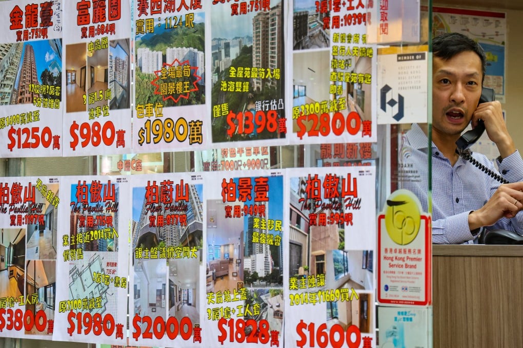 An estate agent works the phone in a shop in Tin Hau, Hong Kong, on April 26, 2024. Photo: Jelly Tse