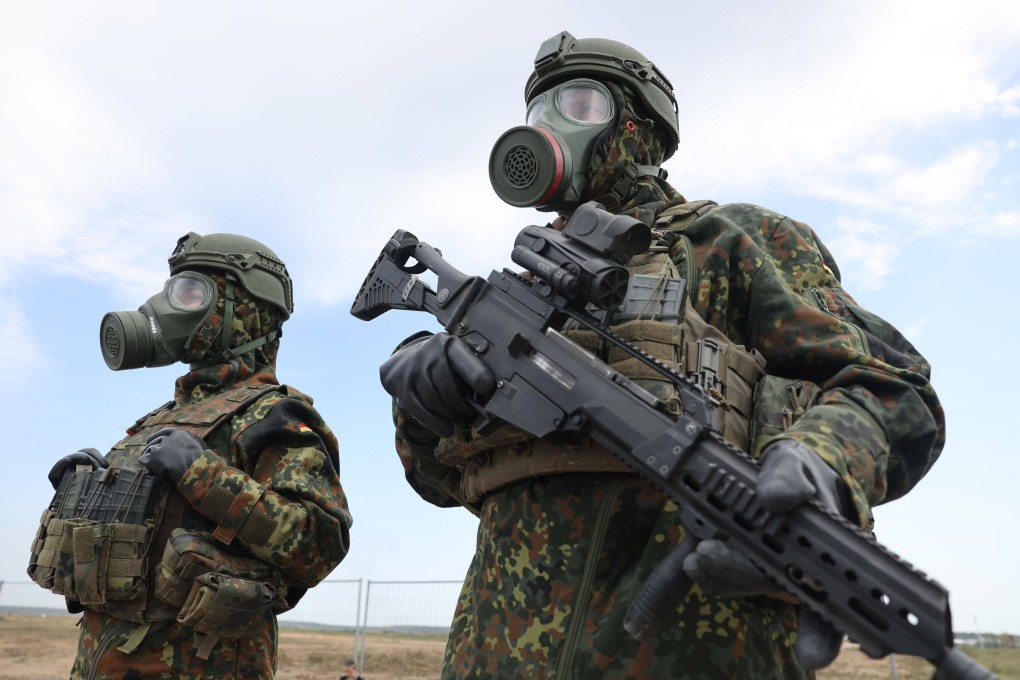 German soldiers wear gas masks during a Nato military exercise in Pabrade, Lithuania, on Wednesday. Photo: Bloomberg