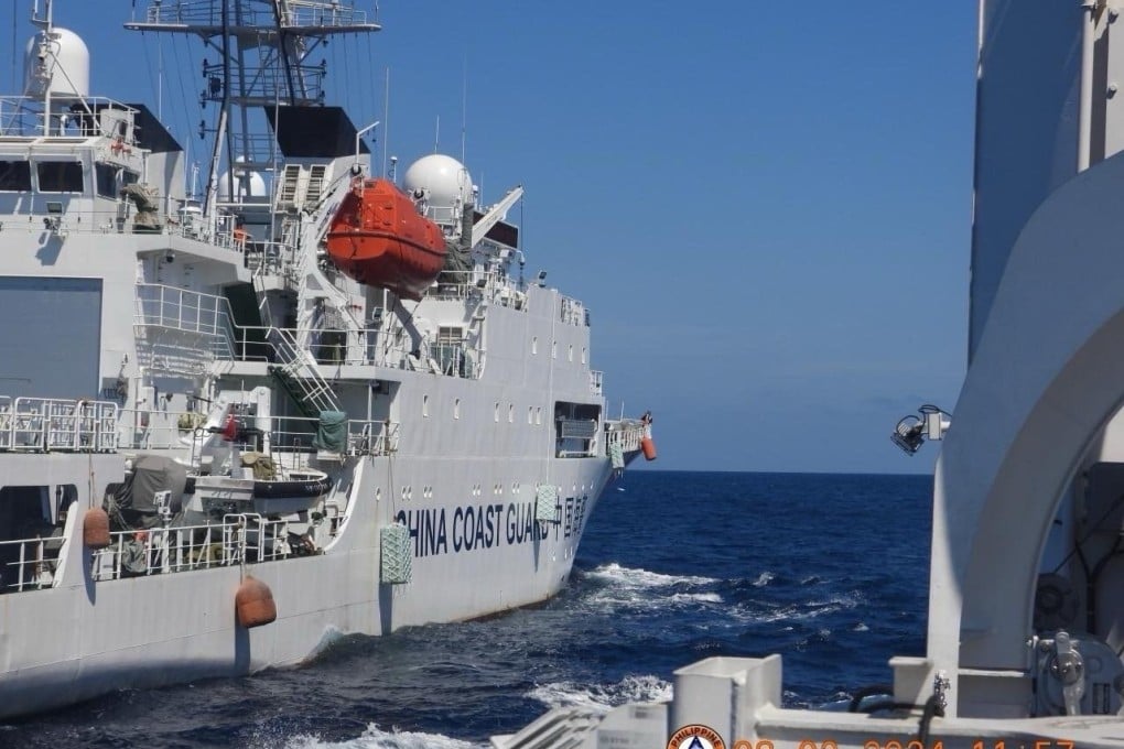 A Chinese coastguard patrol ship manoeuvres near a Philippine coastguard vessel in the vicinity of Scarborough Shoal in the South China Sea. Photo: EPA-EFE