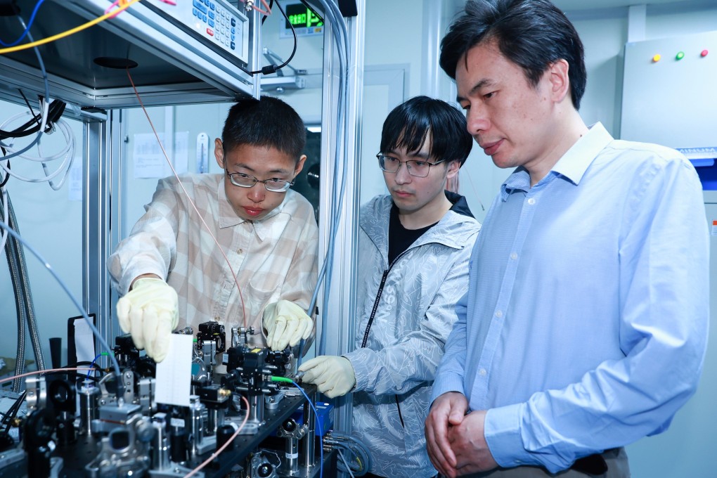 Duan Luming (right) with some members of his quantum computing research team at Tsinghua University. Photo: Handout