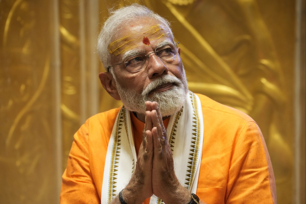 Indian Prime Minister Narendra Modi prays at Kashi Vishwanath Temple after a roadshow in Varanasi, India. Photo: AP