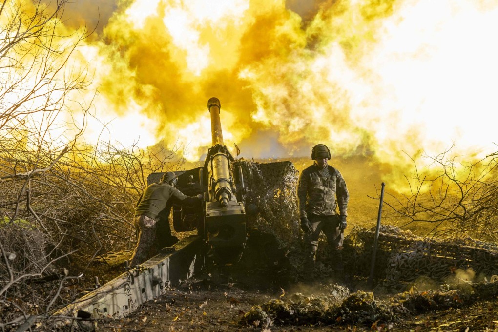 A Ukrainian soldier fires towards Russian positions outside Bakhmut, amid the Russian invasion of Ukraine. Photo: AFP