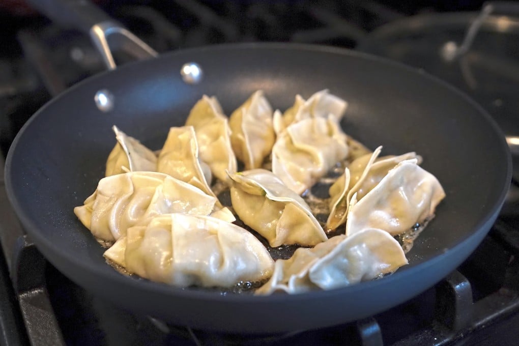 Home-made gyoza dumplings frying. Rie McClenny missed them so much during a year abroad in rural America she began making her own. Now she’s a YouTube regular with her own cookbook. Photo: TNS