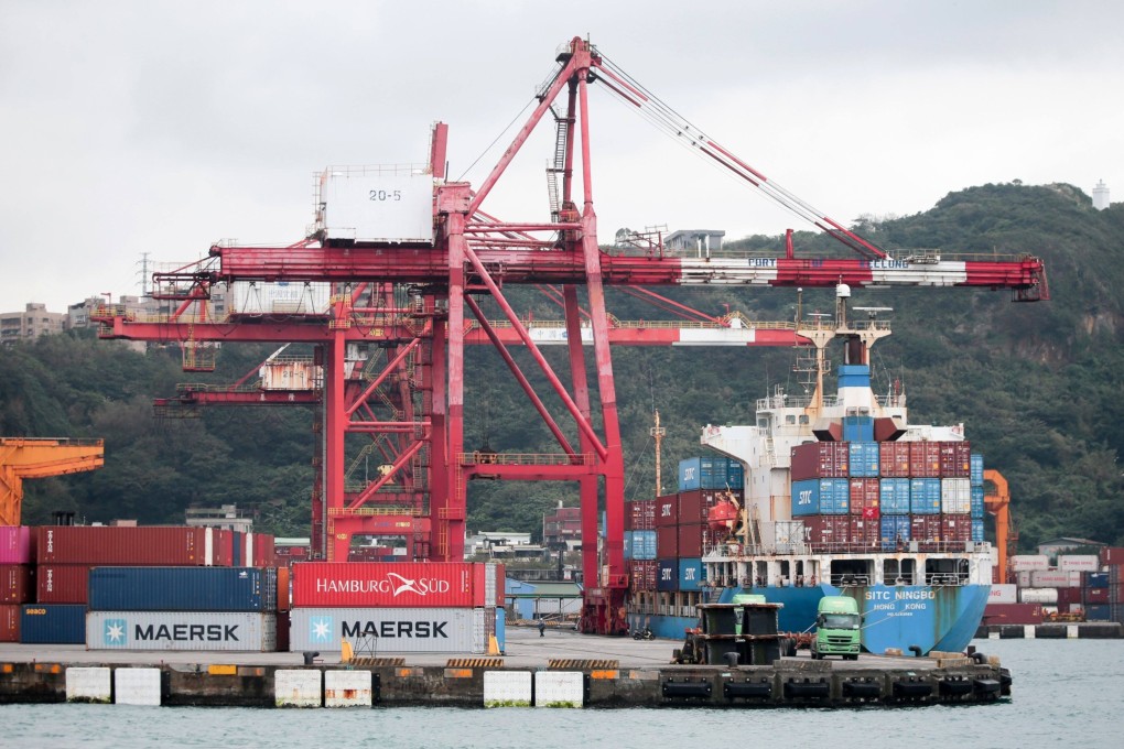 Gantry cranes and a container ship at the Port of Keelung in Keelung, Taiwan. Photo: Bloomberg