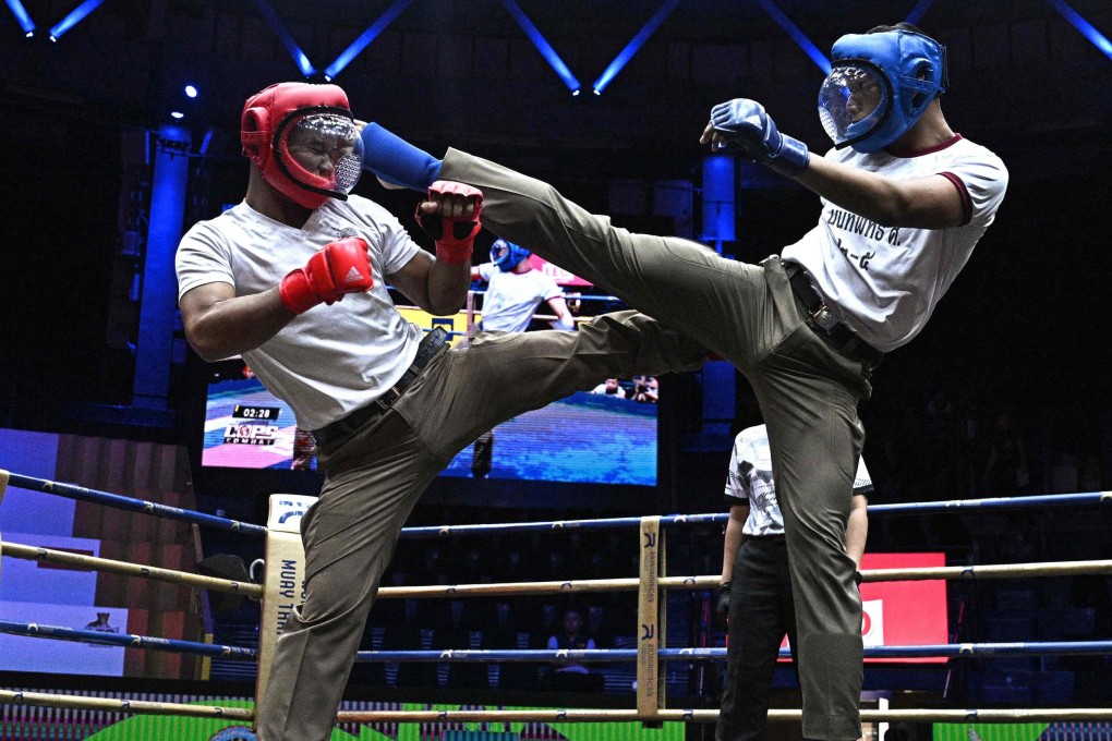 Thai police take part in “Cops Combat,” Thailand’s first martial arts tournament for members of the Royal Thai Police in Bangkok on May 28. Photo: AFP