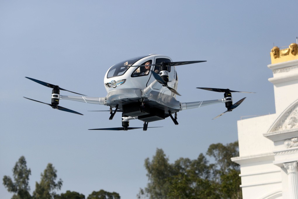 A passenger sits inside an autonomous drone in a test flight in Guangzhou. Photo: Reuters