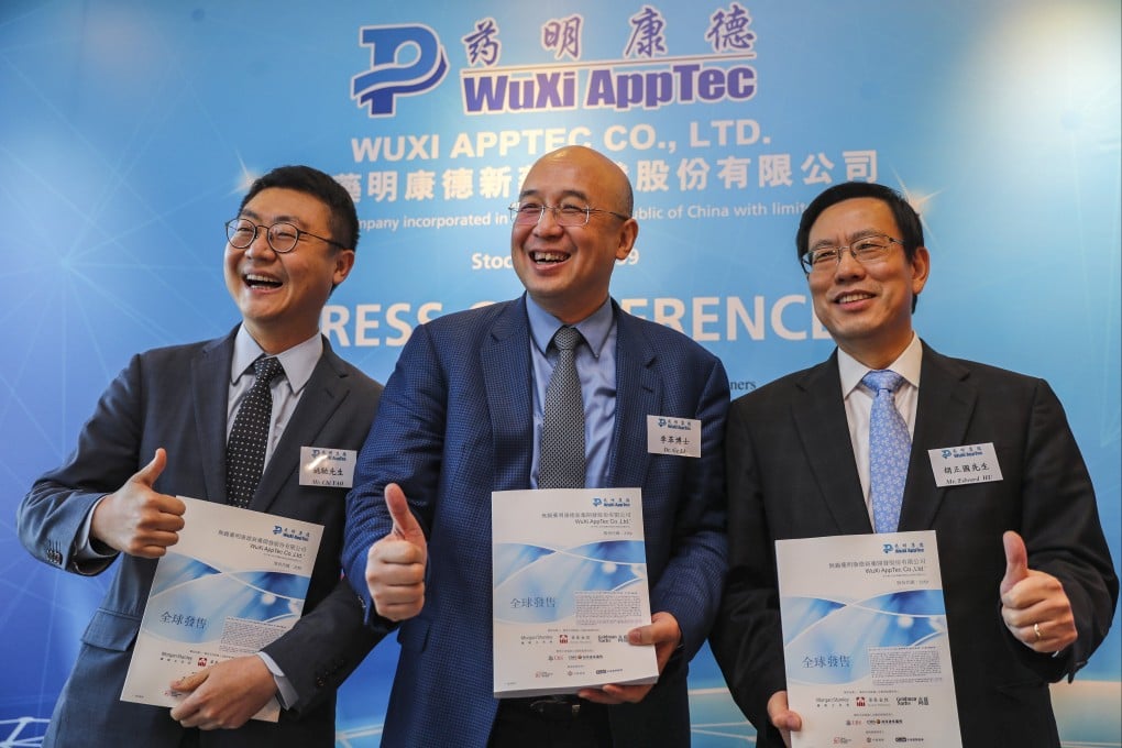 Li Ge (centre) chairman of biotech firm WuXi AppTec in 2018. Photo: Edward Wong