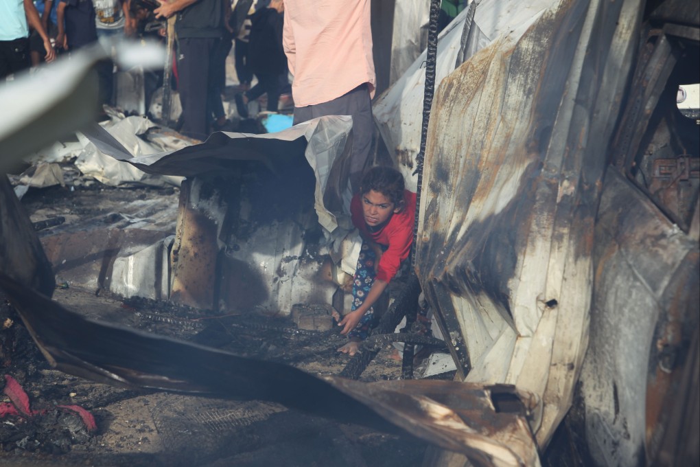 A person is seen at the site of an Israeli strike on a camp for displaced people in Rafah in Gaza on Monday where dozens were killed and others injured a day earlier in an Israeli bombing. Photo: Xinhua