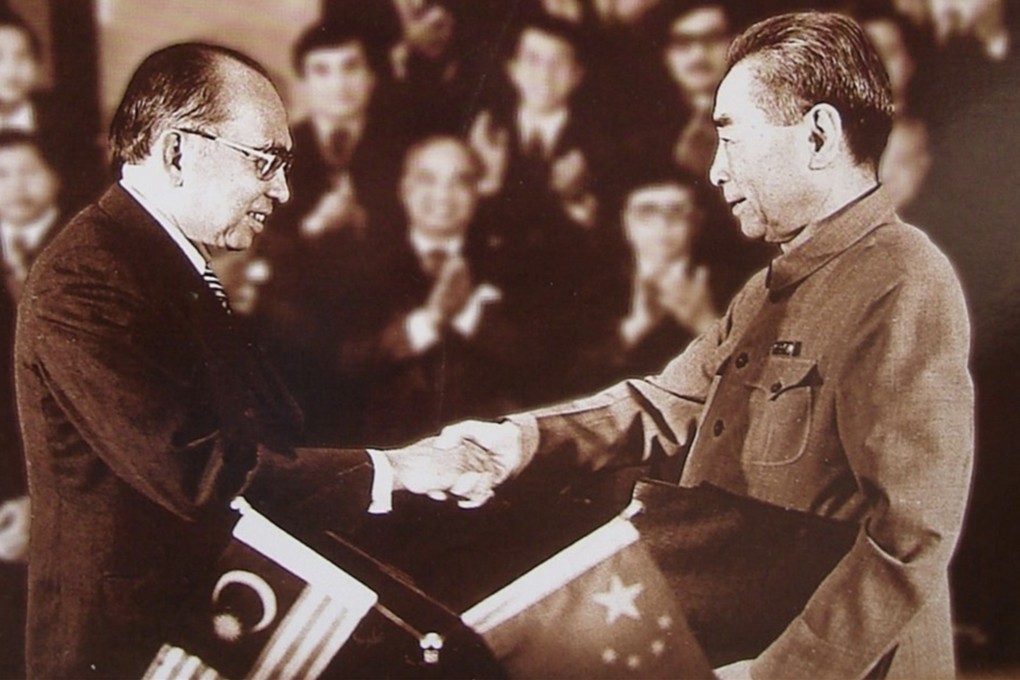 Chinese Premier Zhou Enlai (right) and Malaysian Prime Minister Abdul Razak Hussein shake hands in Beijing after signing a joint communique between their governments announcing the establishment of diplomatic relations on May 31, 1974. Photo: Consulate-General of the People’s Republic of China in Kuching/Handout