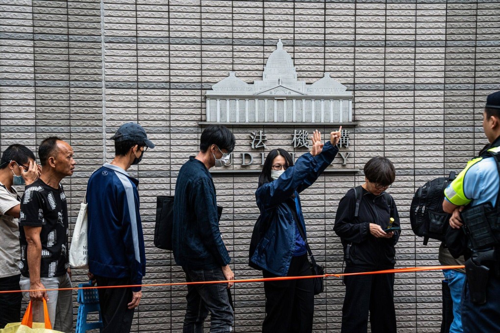 Members of the public wait to enter West Kowloon Court on Thursday. Photo: Bloomberg