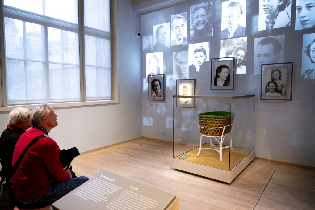 Visitors view a display at the newly opened National Holocaust Museum in Amsterdam, which is co-hosting an exhibition about the impact of Nazi German occupiers’ looting of Jewish family possessions. Photo: AFP
