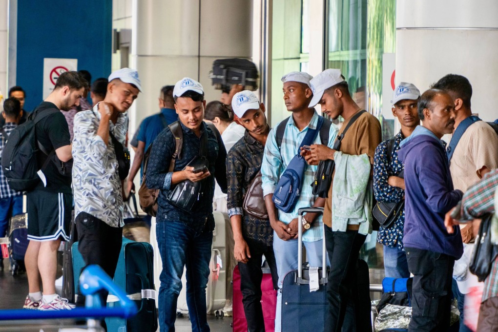 Bangladeshis congregating at the Kuala Lumpur International Lumpur as they rush to beat a May 31 deadline imposed by Malaysia’s government for legal work registration.  Photo: Hadi Azmi