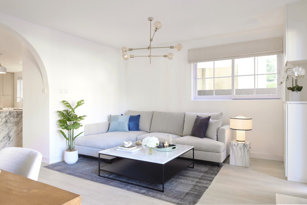 The living area in the house in a village in Sai Kung, Hong Kong, designed by Britta Butler. The sofa, coffee table and rug all came from Tree in Hong Kong. The house was renovated for a couple who had been renting the house before deciding to buy it. Photo: Steve Wong