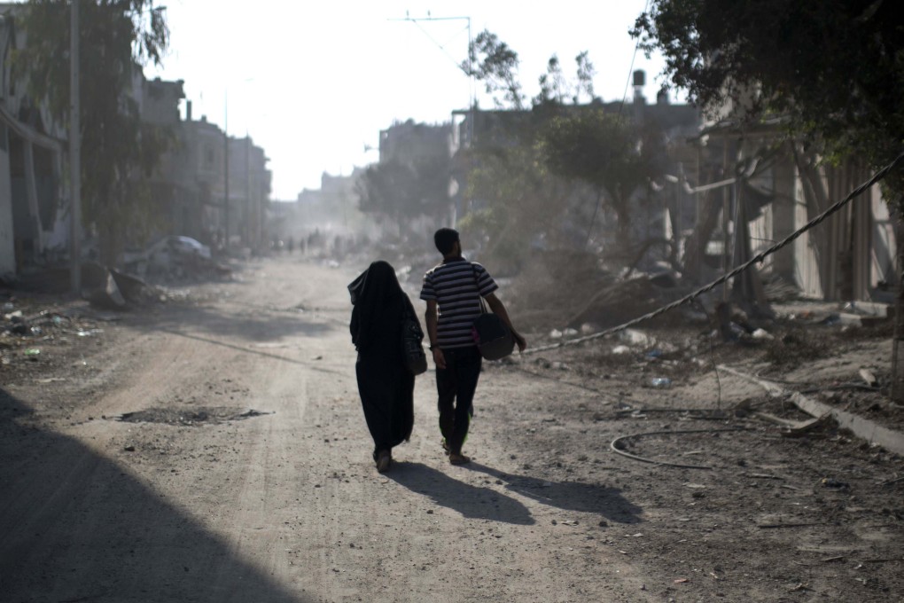 Palestinians check their homes in Gaza City’s Shejaiya neighbourhood amid the ongoing Israel-Hamas war. Photo: AFP