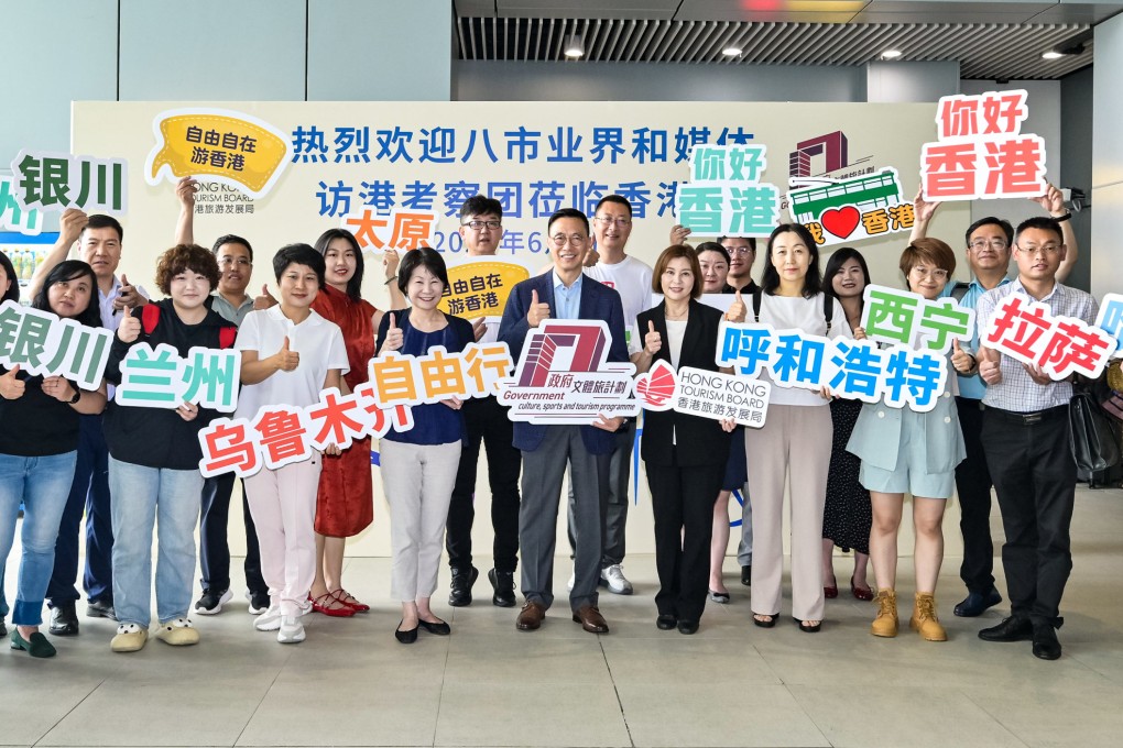 Tourism minister Kevin Yeung (centre) welcomes industry representatives and media from eight mainland cities at the Tourism Board visitor centre located at Heung Yuen Wai Boundary Control Point. Photo: ISD handout.