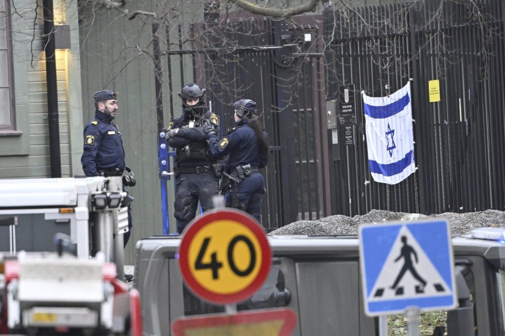 Armed police stand near the Israeli embassy in Stockholm. Swedish police found a live grenade within the Israeli embassy compound earlier this year. Photo: TT News Agence via AP