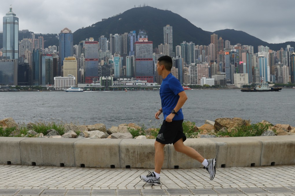A jogger runs along the waterfront at West Kowloon Cultural District on June 23, 2023. While shoe technology has made vast progress, many of the innovations are aimed more at high-performing runners instead of the general public. Photo: Dickson Lee