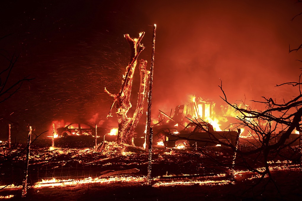 A home burns during the Corral Fire west of Tracy, California on Saturday. Photo: The Press Democrat via AP