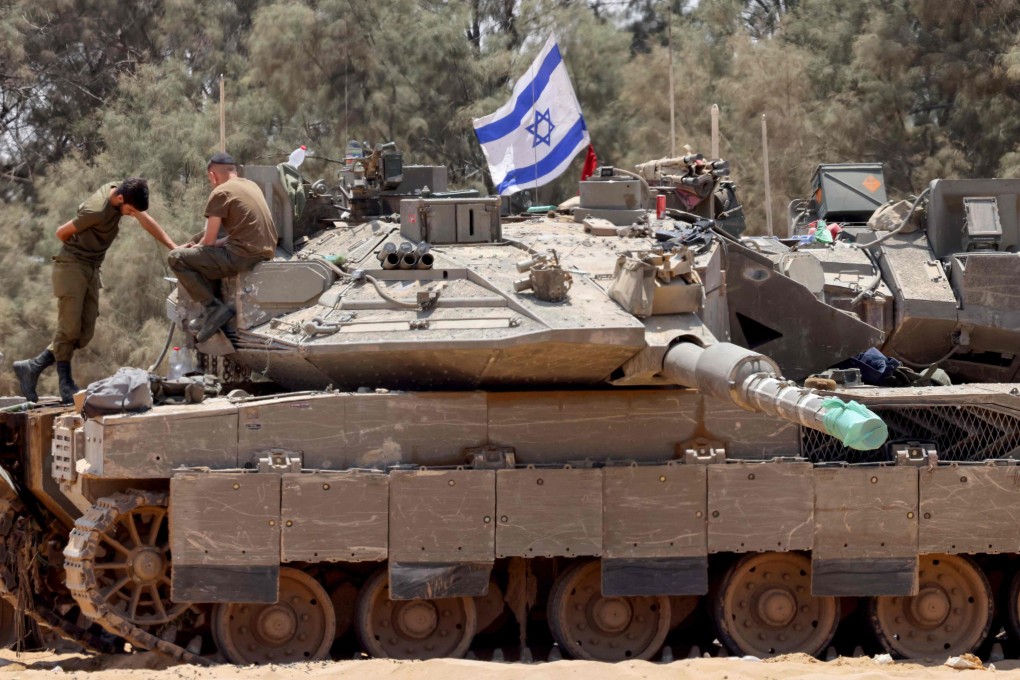 Israeli army tanks are positioned in an area of Israel’s southern border with the Gaza Strip on May 29 amid the ongoing conflict between Israel and the Palestinian militant group Hamas. Photo: AFP