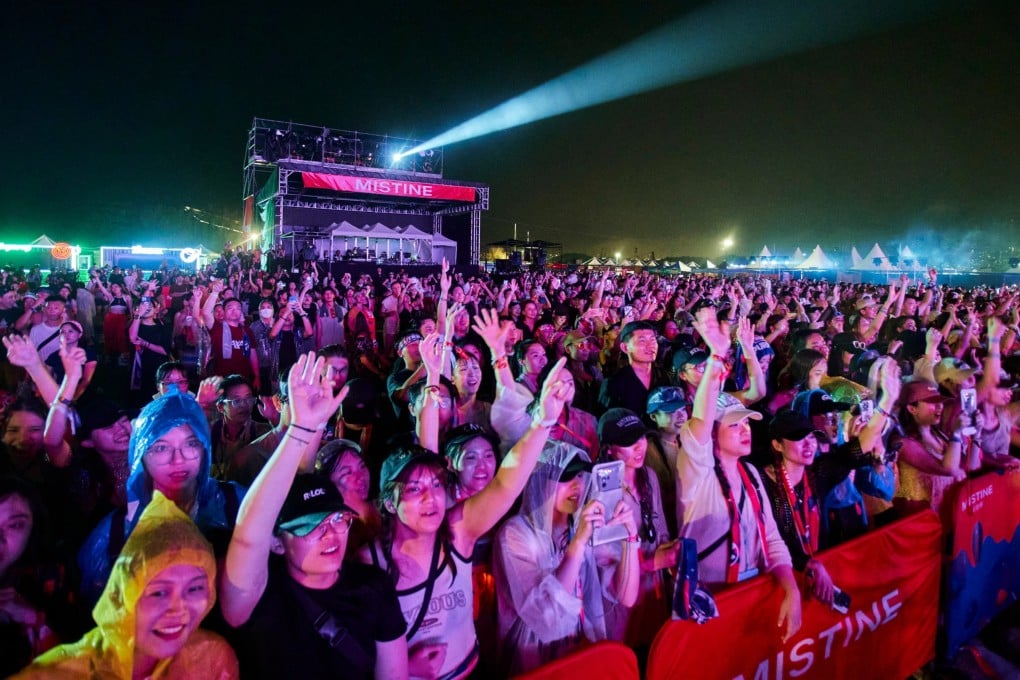 Music fans enjoy the Waterbomb festival, after weather caused chaos and massive queues before the start of the event, which was also delayed. Photo: Handout