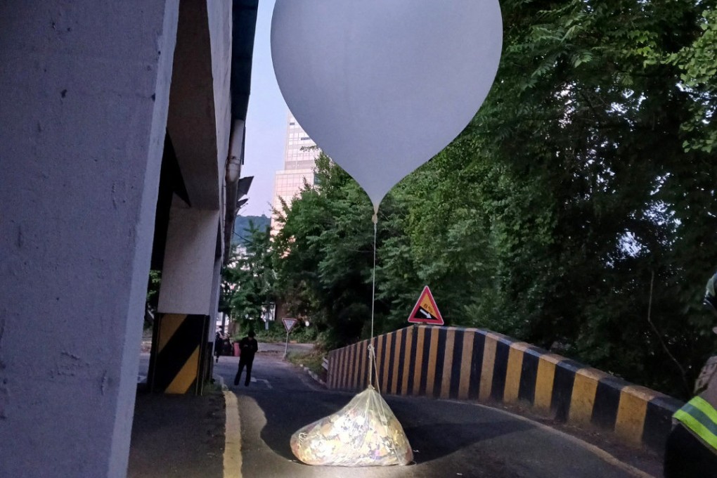 A balloon believed to have been sent by North Korea, carrying various objects including what appeared to be trash, is pictured in Incheon, South Korea, on Sunday. Photo: Yonhap via Reuters