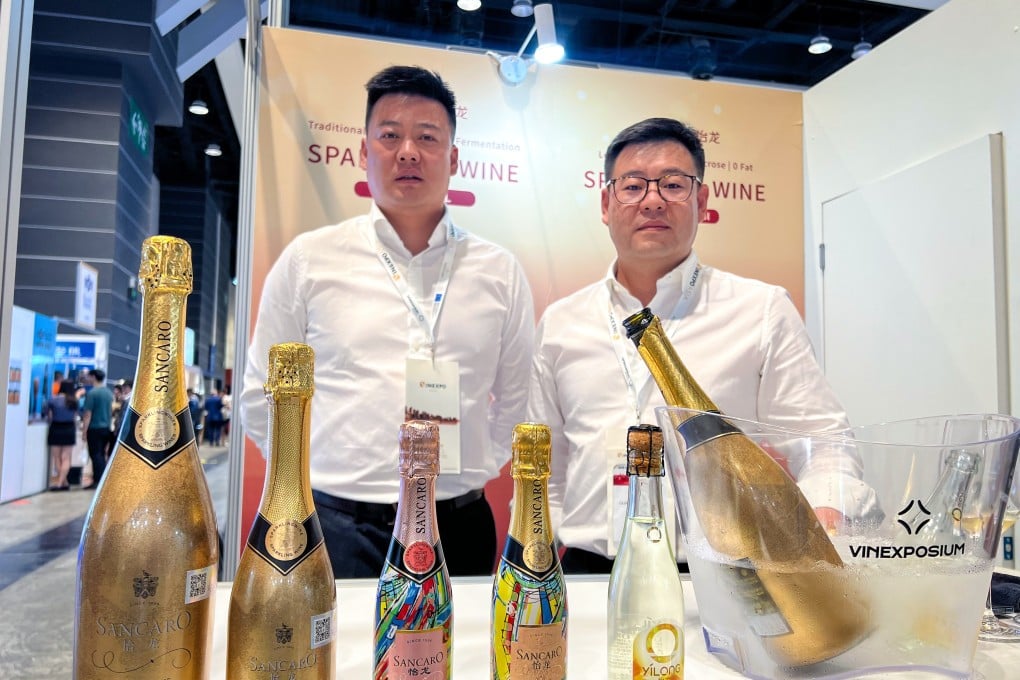 Yu Zhiyong (right) and his brother Yu Zhichao at their booth at the Vinexpo Asia event in Hong Kong. Photo: Mia Nulimaimaiti