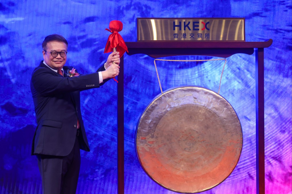 UBoT Holding chairman Danny Tong strikes the gong to mark the company’s listing on the GEM board on Monday. Photo: Jonathan Wong