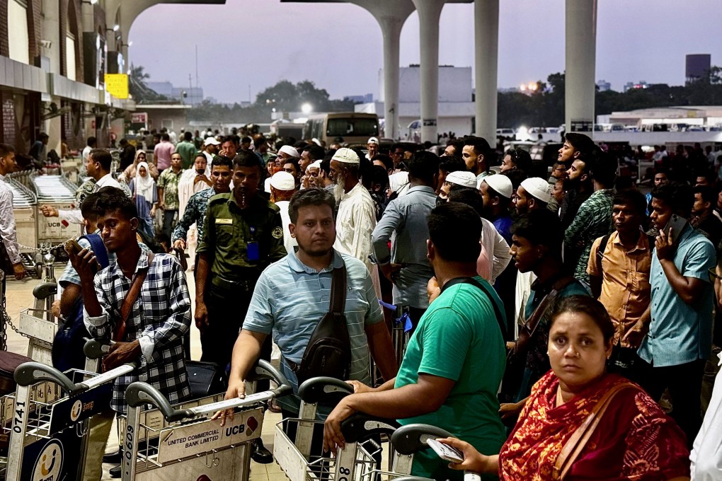 Prospective migrants and their families gather outside Dhaka airport last Friday, awaiting updates about their tickets. Photo: Redwan Ahmed