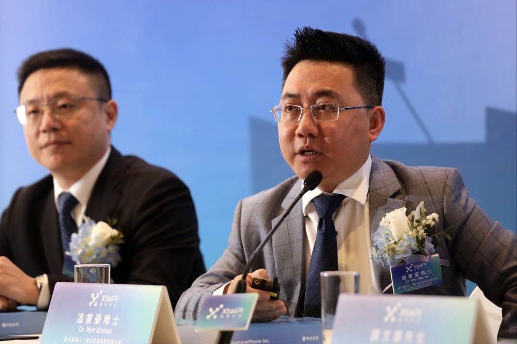 Ma Jian, co-founder, executive director and CEO (left), and Wen Shuhao, co-founder, executive director and chairman, of QuantumPharm speak during a press conference for the company’s IPO in Hong Kong on June 3, 2024. Photo: Xiaomei Chen