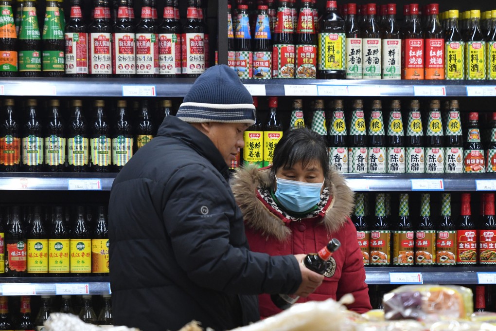 Customers buy sauce at a supermarket in Fuyang, Anhui province, China. Condiments like these are the secret to good Chinese food, writes Andrew Sun. Photo: Getty Images