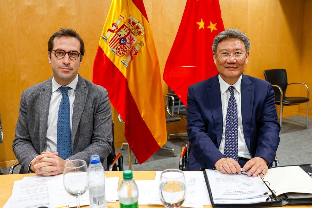 Minister of Commerce Wang Wentao (right) and Spanish Minister for Economy, Trade and Enterprise Carlos Cuerpo sit together at the 29th China-Spain Joint Economic and Industrial Cooperation Committee on Monday. Photo: EPA-EFE