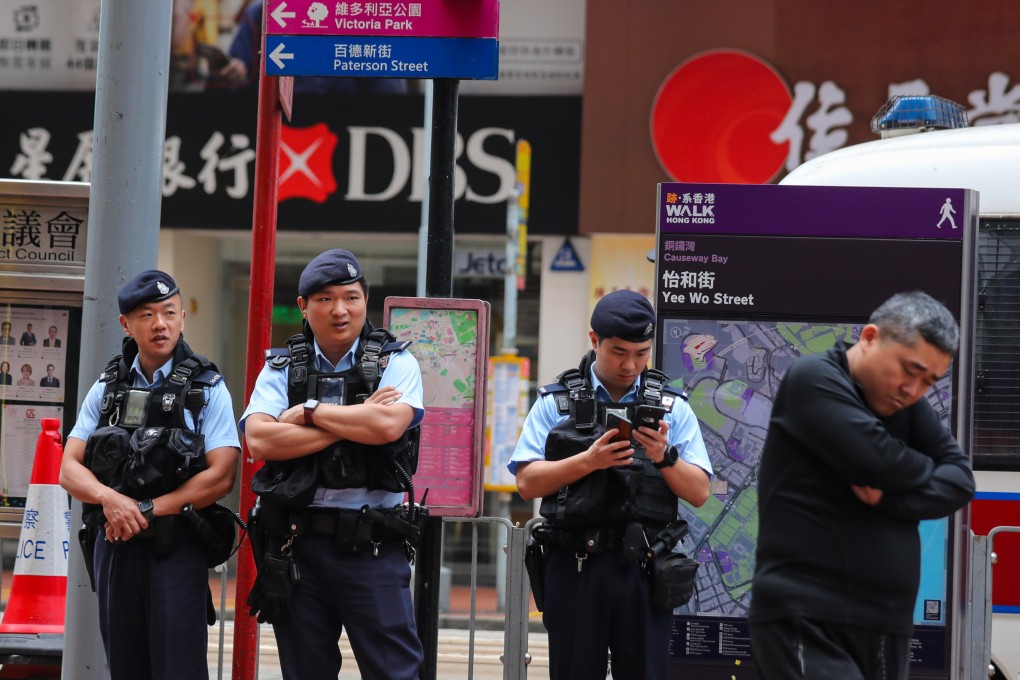 Police officers stage a show of force in the area around Causeway Bay’s Victoria Park, the traditional venue for the commemoration of the Tiananmen Square crackdown. Photo: Xiaomei Chen