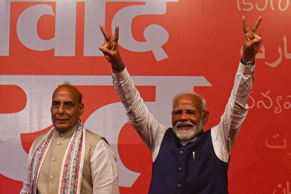 Indian Prime Minister Narendra Modi (right) gestures at Bharatiya Janata Party headquarters in New Delhi as results come in for the country’s general elections on Tuesday. Photo: dpa