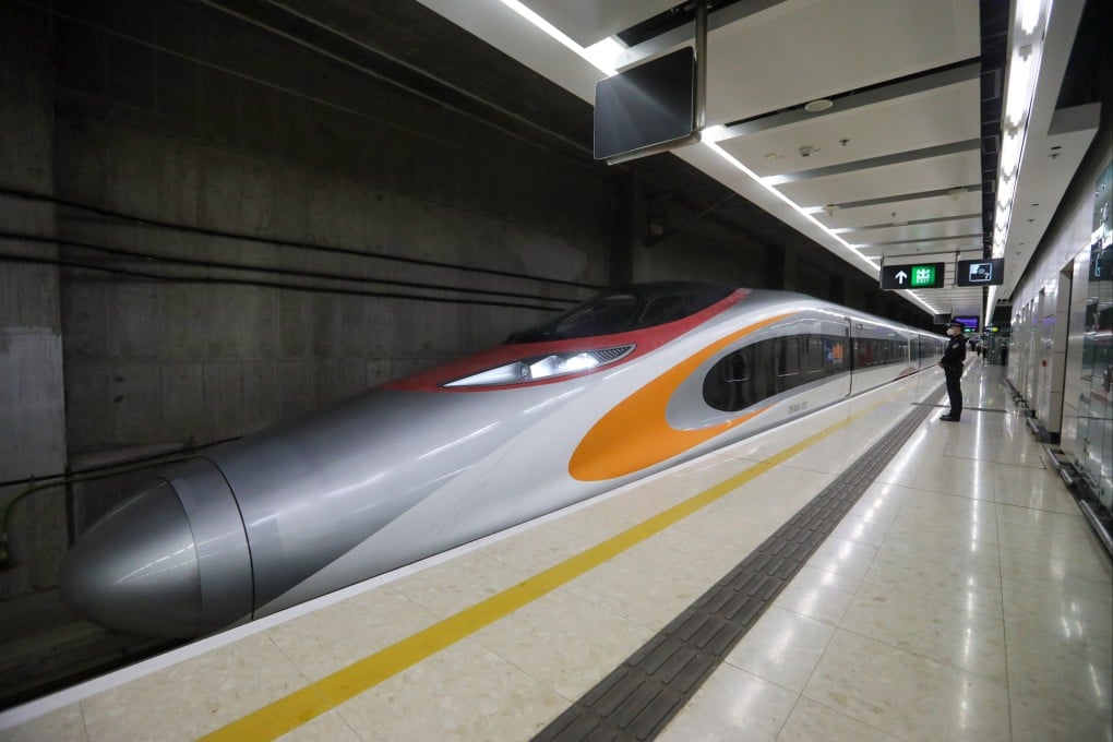 A high-speed train operating on the Guangzhou-Shenzhen-Hong Kong Express Rail Link departs from West Kowloon Station. Photo by Lu Li