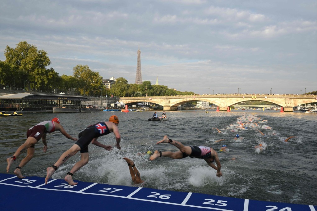 Triathletes dive into the Seine during the men’s 2023 World Triathlon Olympic Games Test Event in Paris last August. Photo: AFP