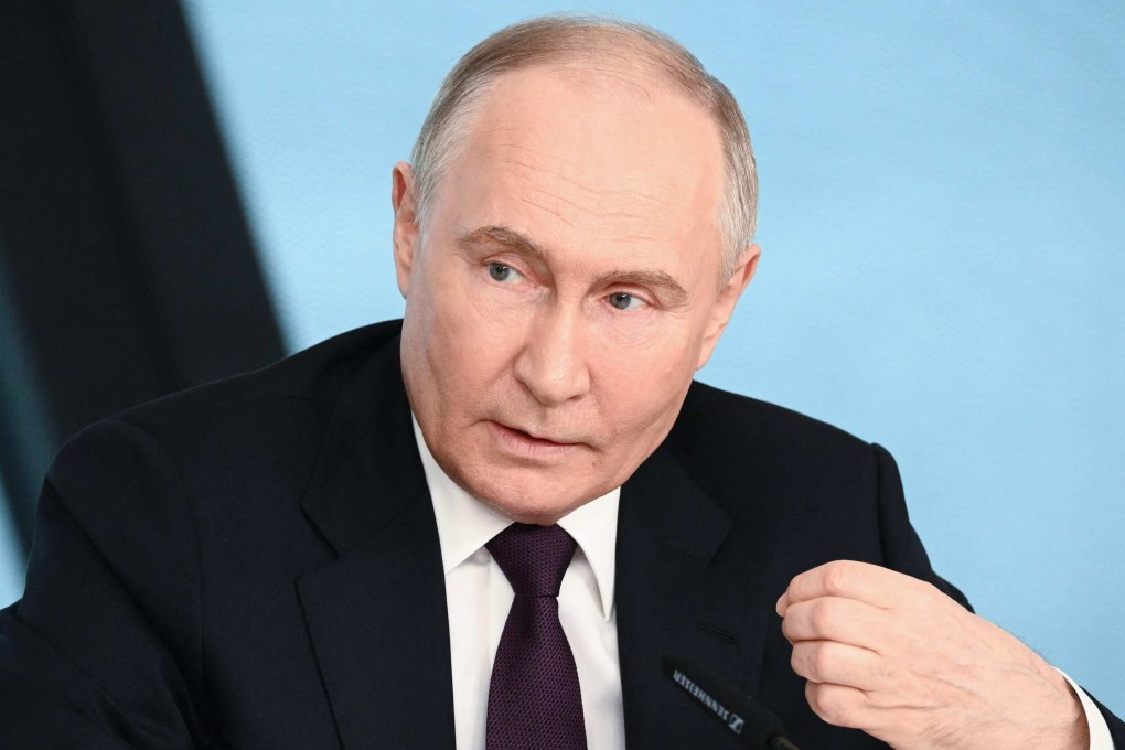 Russia’s President Vladimir Putin speaks with heads of International news agencies in St Petersburg. Photo: AFP