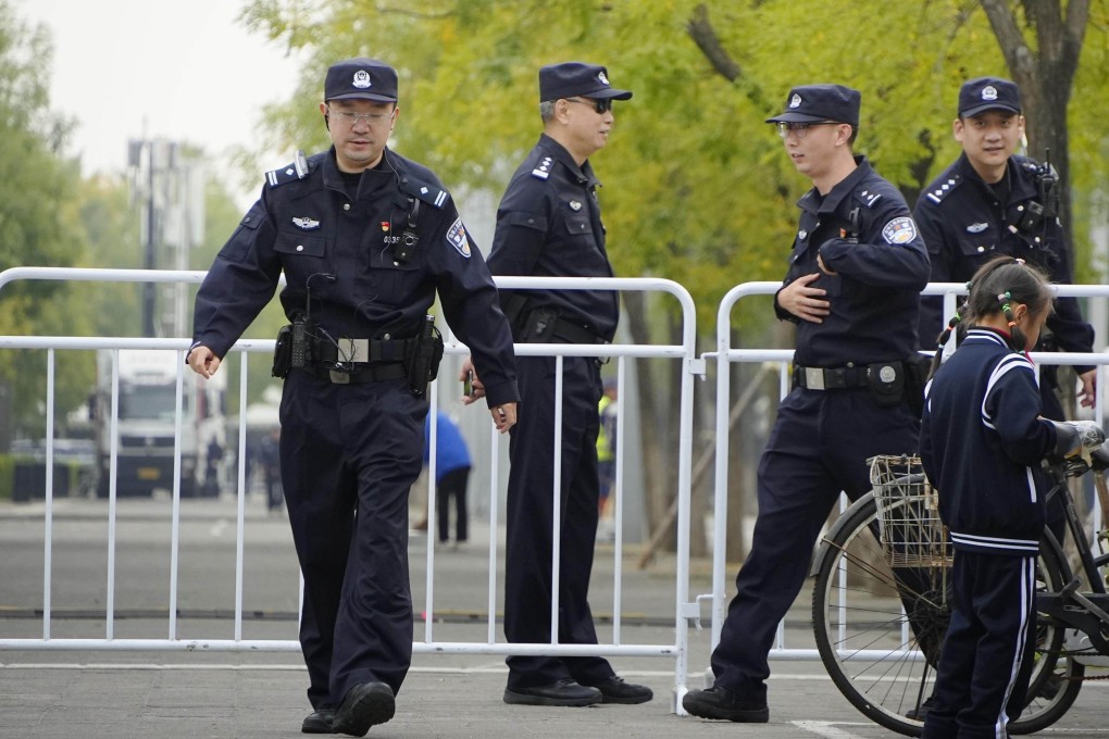 In Beijing, a district police bureau’s ad for auxiliary officers states that anyone who has studied, worked or lived outside mainland China for more than six months is not eligible to apply. Photo: Kyodo