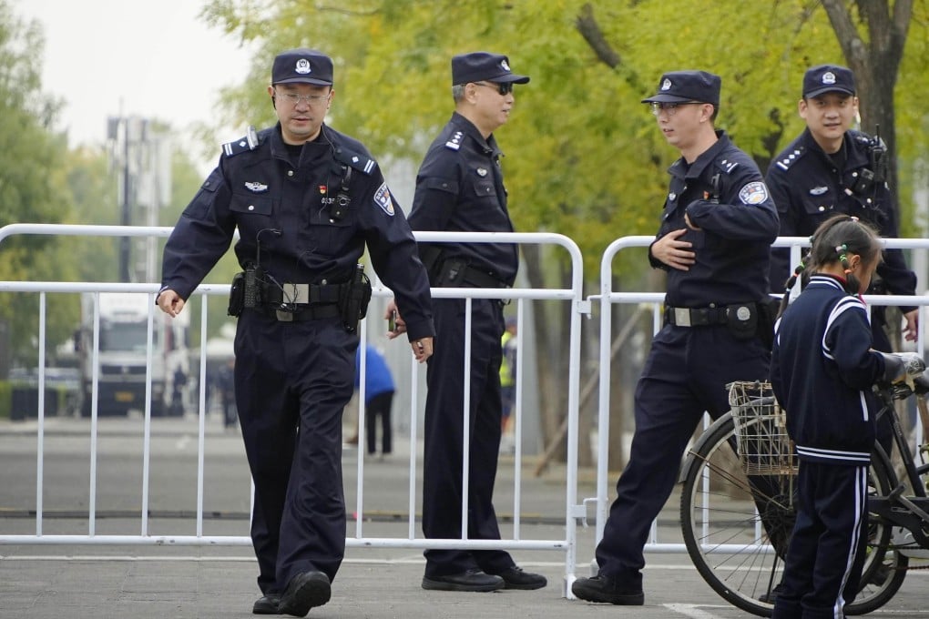 In Beijing, a district police bureau’s ad for auxiliary officers states that anyone who has studied, worked or lived outside mainland China for more than six months is not eligible to apply. Photo: Kyodo