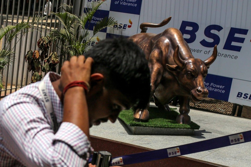 A man walks past a bronze bull statue outside the Bombay Stock Exchange building in Mumbai, India, on June 3. Photo: Bloomberg