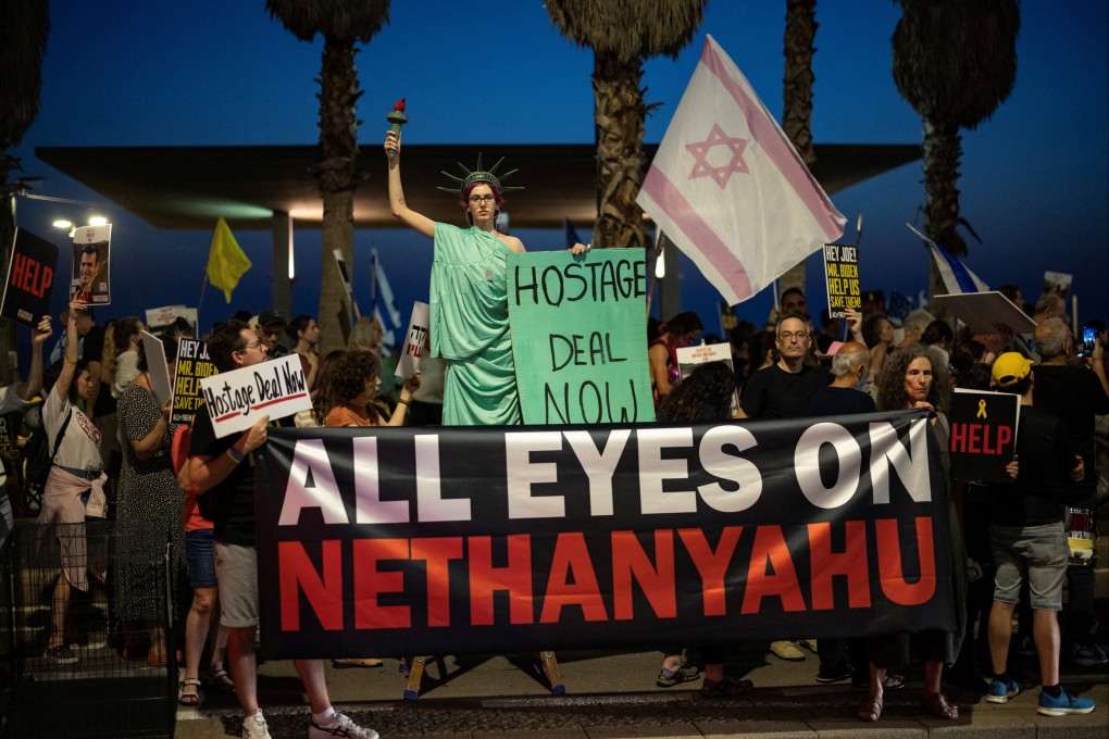A demonstrator poses as the Statue of Liberty during a rally outside the US consulate in Tel Aviv, Israel, on Monday. Photo: Reuters