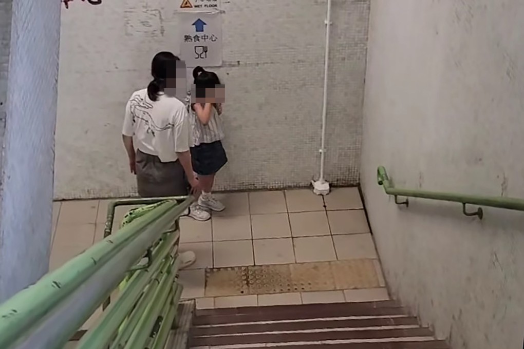 The video clip also shows a woman scolding the girl and slapping her on the backstairs of a building. Photo: Facebook/Boll Che Li