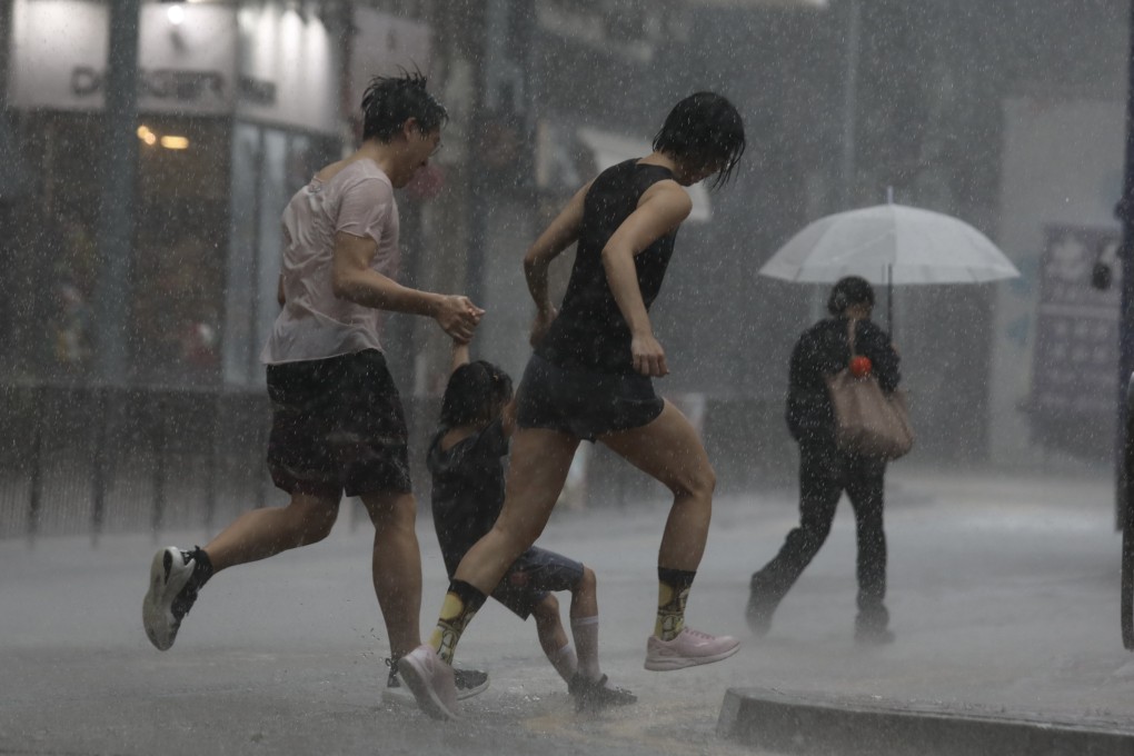 People run in squally weather associated with Typhoon Maliksi in Kennedy Town on June 1. Hong Kong remains a unique and exciting international city in Asia. Photo: Xiaomei Chen