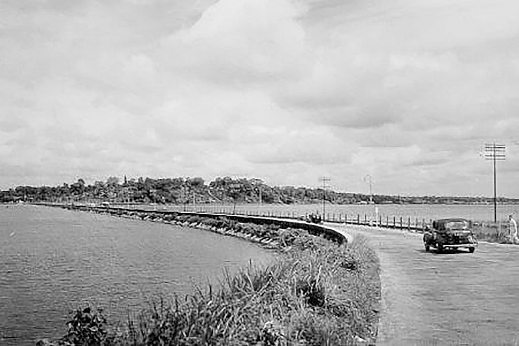 The Johor-Singapore causeway as seen from the Woodlands end in the 1940s. A popular legend involving its construction claims human skulls were incorporated into the foundations to appease evil spirits. Photo: Handout
