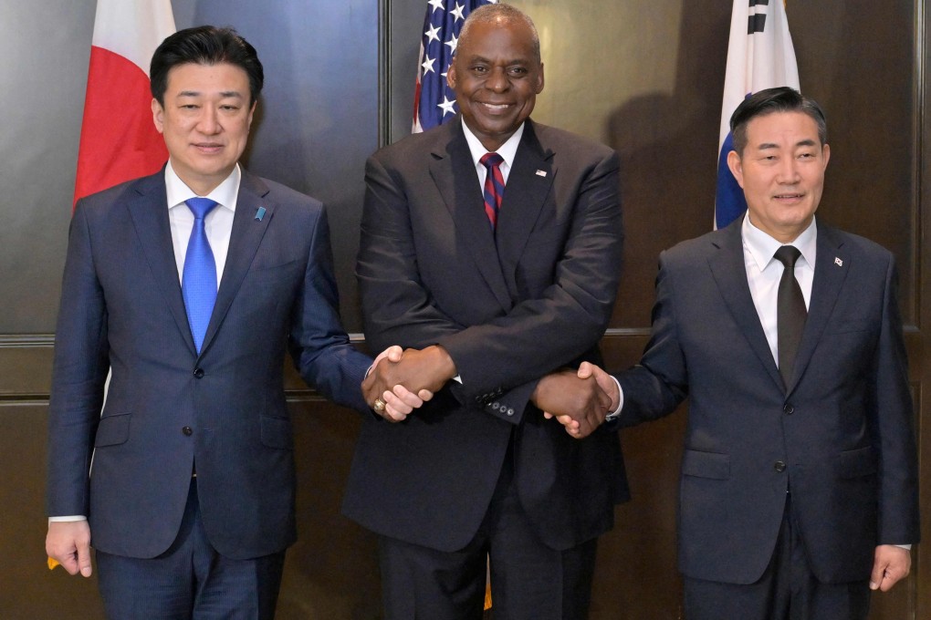 (From left) Japanese, US and South Korean defence chiefs Minoru Kihara, Lloyd Austin and Shin Won-sik meet on the sidelines of the Shangri-La Dialogue in Singapore on Sunday. Photo: AFP