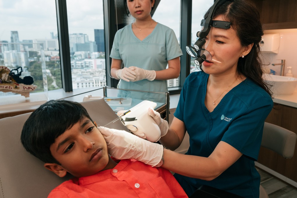 Singaporean doctor Lynne Lim demonstrates the world’s first handheld robotic device for ear tube surgery, which she developed with the National University of Singapore. It has won her a Cartier Women’s Initiative award.  Photo: Cartier