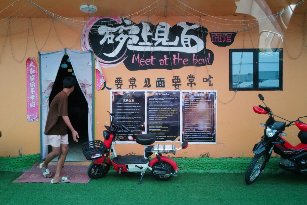 A man exits a Chinese restaurant in Santa Ana, near the Philippines’ northernmost EDCA site used by US forces. Photo: Jeoffrey Maitem