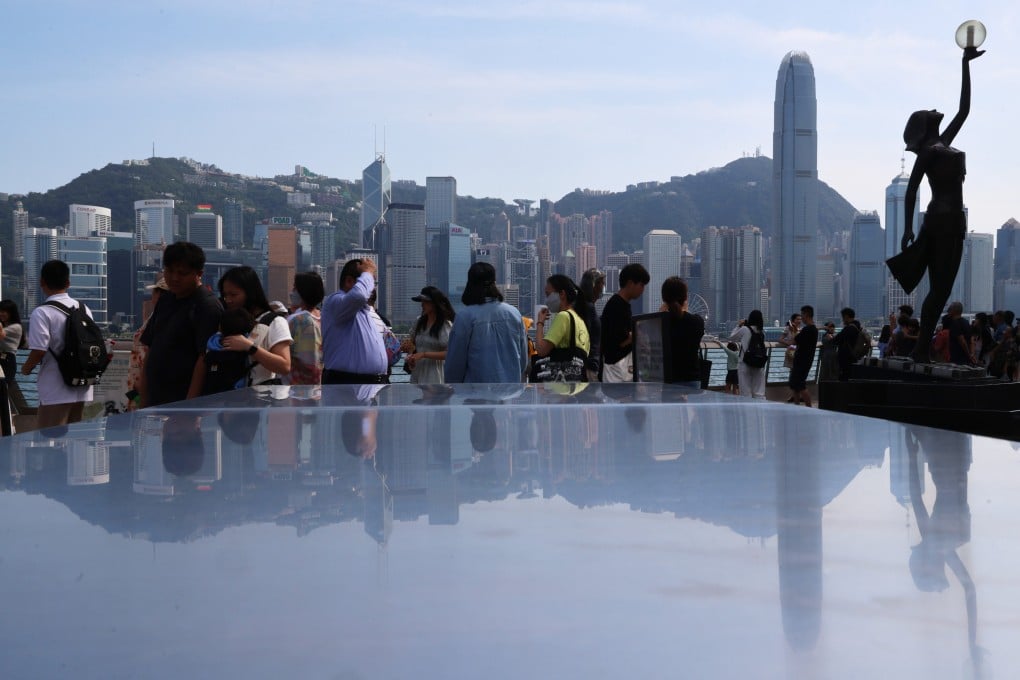 Visitors take in the harbour view along the Tsim Sha Tsui waterfront on May 15. Photo: Jelly Tse