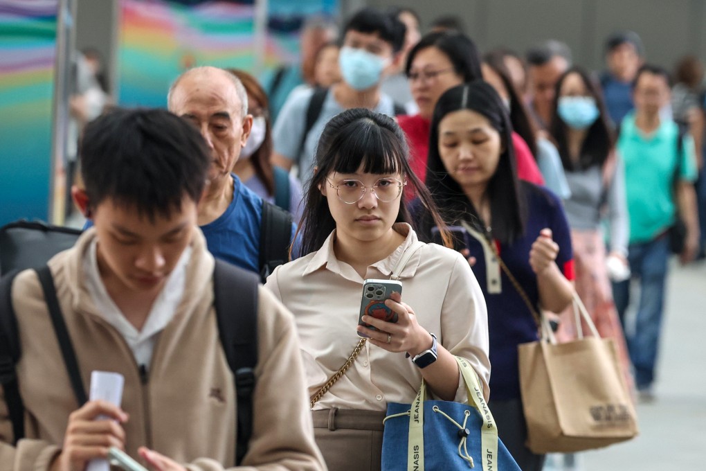 Civil servants leave government offices in Admiralty. Hong Kong has updated the Civil Service Code to ensure “loyalty, dedication and integrity”. Photo: Edmond So