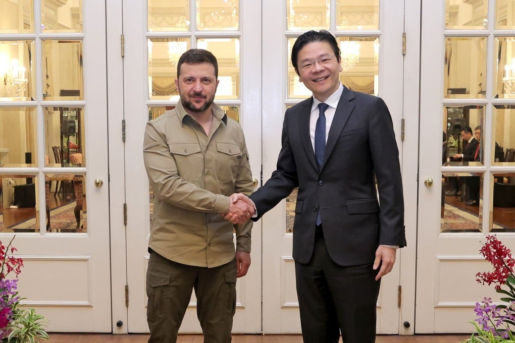 Singapore Prime Minister Lawrence Wong shaking hands with Ukraine President Volodymyr Zelensky during their meeting at the Istana or Presidential Palace on June 2, 2024. Photo: EPA-EFE