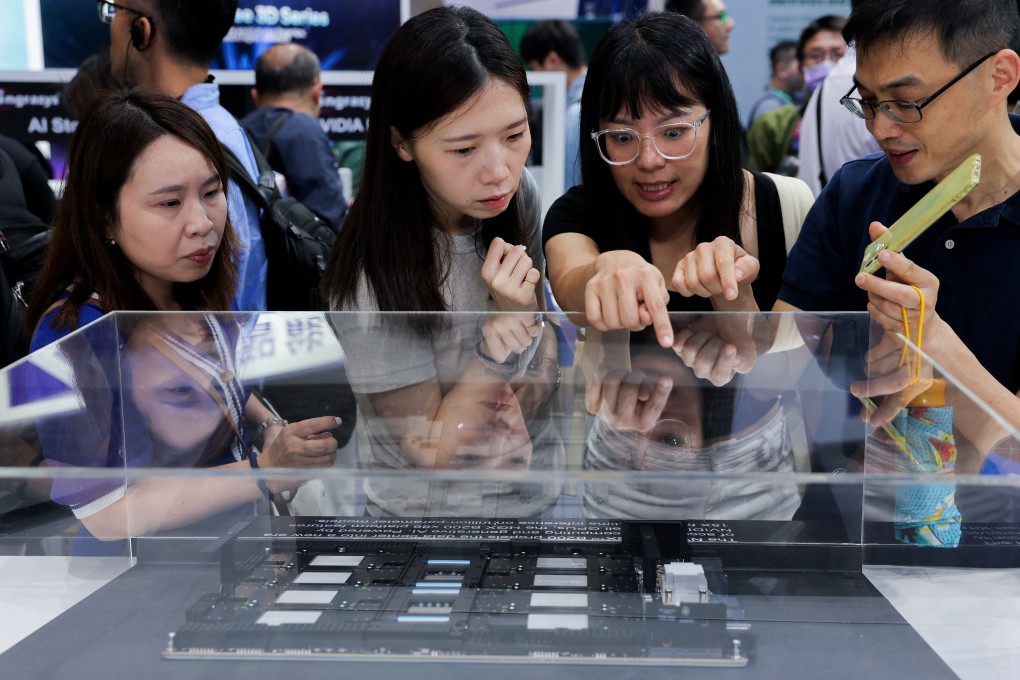 A group of people study equipment on display at the Computex Taipei trade show in Taiwan on Wednesday. Photo: Reuters